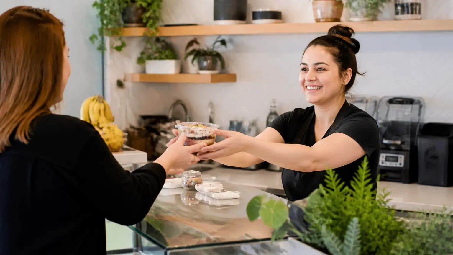 Helping customers at Panadería Vanessa